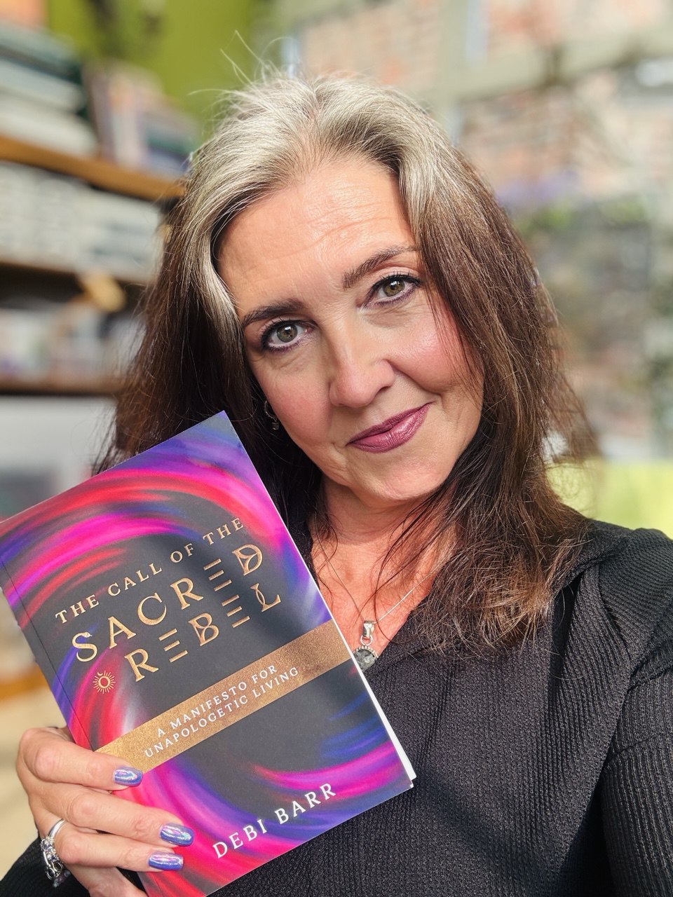 Linda with the Sacred Rebel book